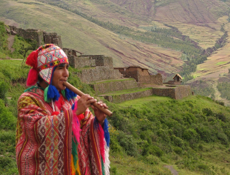 File:Quetchua musician with Inca ruins of Pisac in background Andes Mts Peru copy.jpg